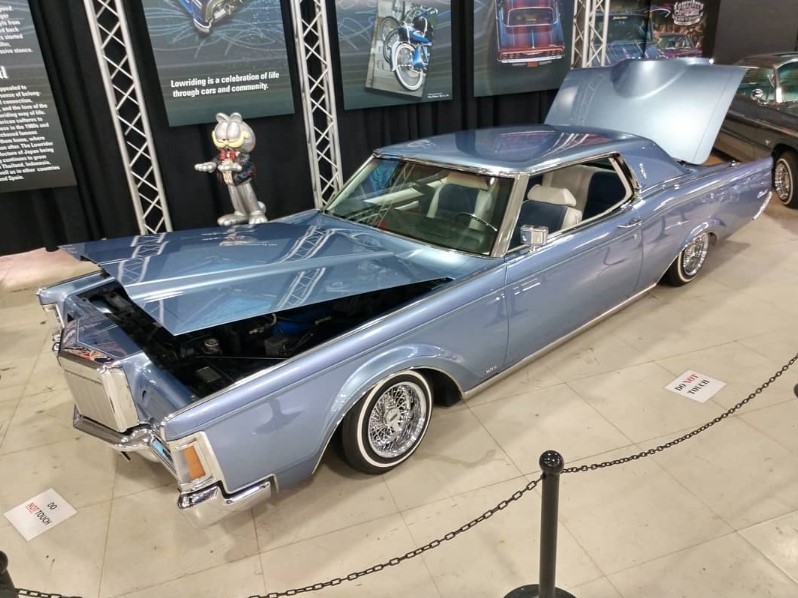 Restored vintage automobile on display inside the San Diego Automotive Museum