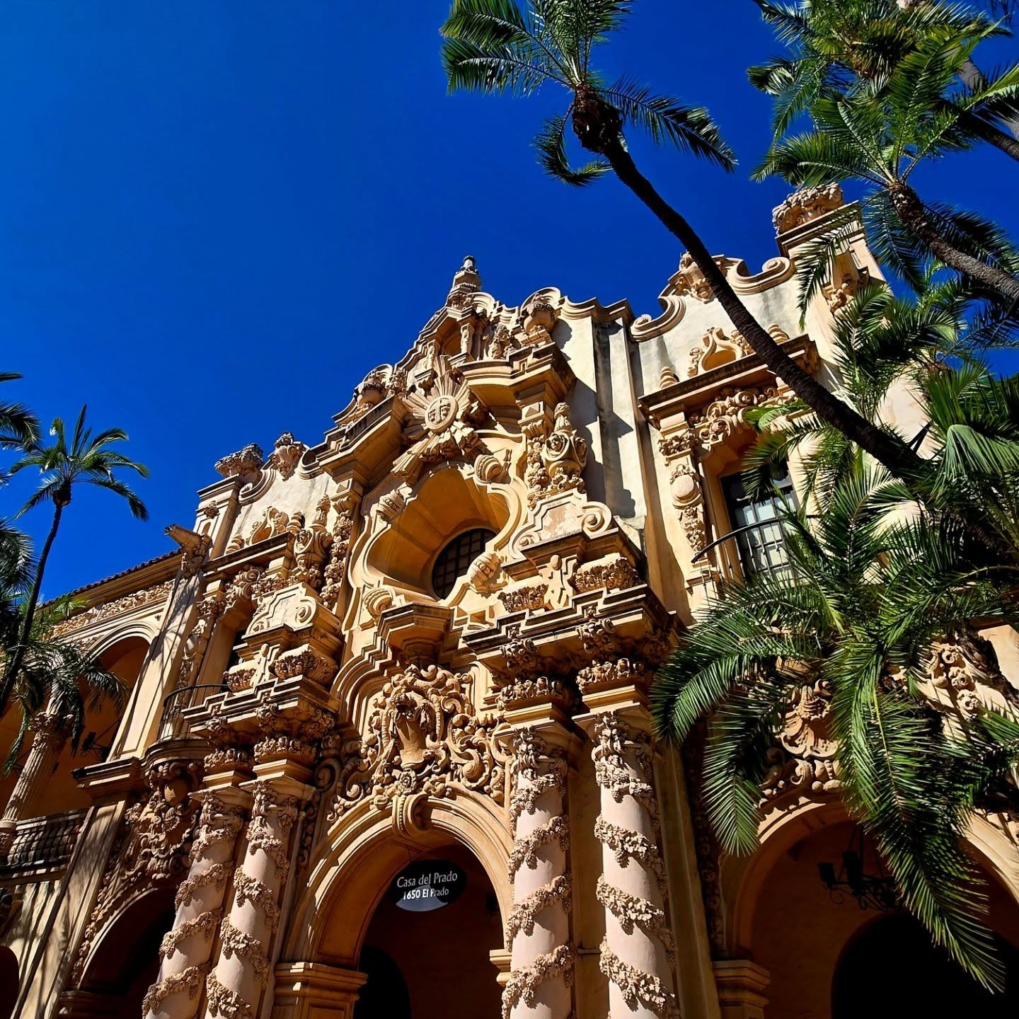 Ornate carved stone archway detail on a Spanish Colonial Revival museum building in Balboa Park