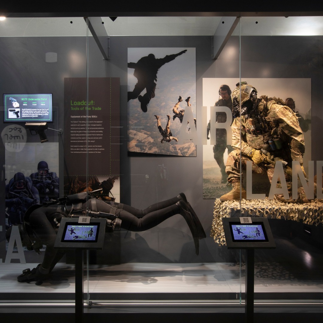 Outdoor military watercraft and vehicle exhibit at the Navy SEAL Museum in Coronado, San Diego