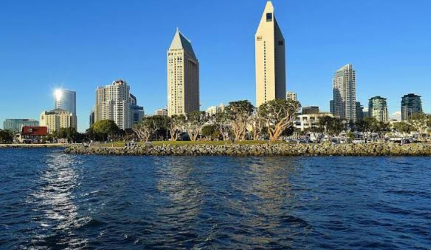 San Diego downtown skyline and Embarcadero waterfront promenade at golden hour